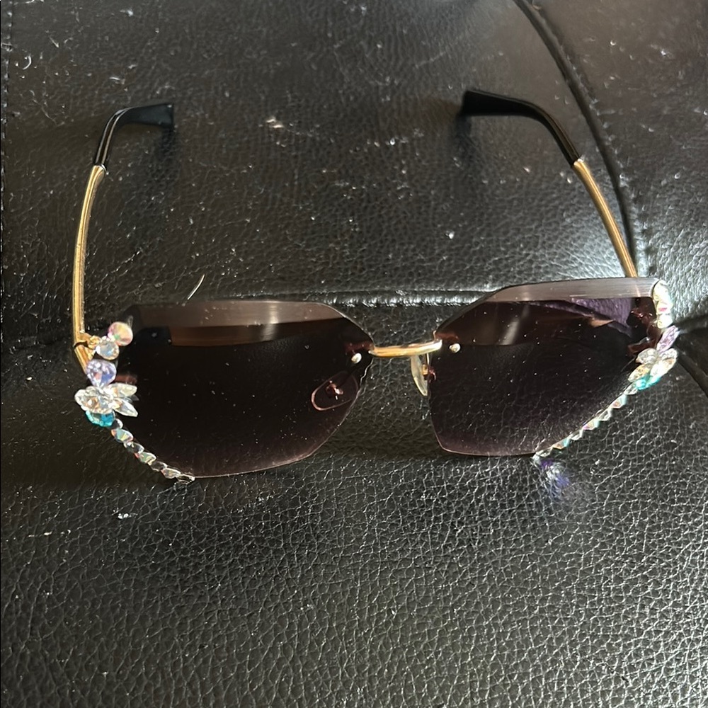 Chic Gold and Black Sunglasses with Playful Charms